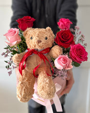 Load image into Gallery viewer, Person holding a floral arrangement with a teddy bear
