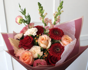 Peach and Red Charm bouquet close up